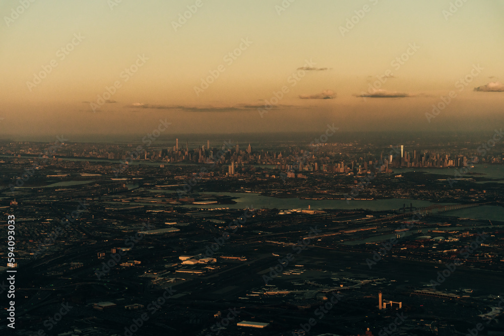 view of new york and new jersey from the plane on sunset