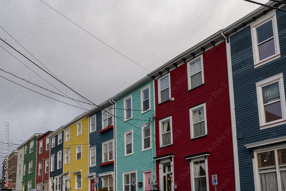 Building Colors View Street view of multiple colorful wooden buildings of various colors ...