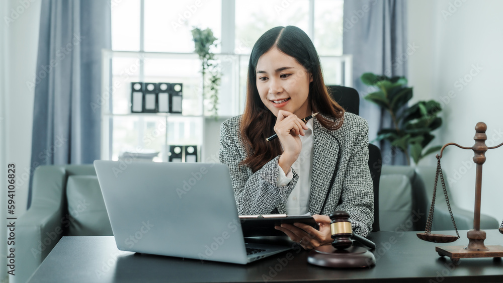 Online consulting with laptop in office of asian thai japanese chinese female exclusive lawyer legal advisor, legislation, saleswoman, legal contract documents Online consulting with laptop in office of asian thai japanese chinese female exclusive lawyer legal advisor, legislation, saleswoman, legal contract documents