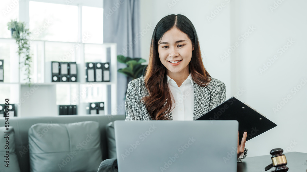 Online consulting with laptop in office of asian thai japanese chinese female exclusive lawyer legal advisor, legislation, saleswoman, legal contract documents Online consulting with laptop in office of asian thai japanese chinese female exclusive lawyer legal advisor, legislation, saleswoman, legal contract documents