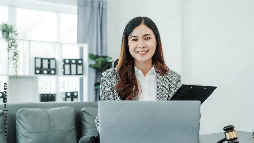 Looking camera, Online consulting with laptop in office of asian thai japanese chinese female exclusive lawyer legal advisor, legislation, saleswoman, legal contract documents Looking camera, Online consulting with laptop in office of asian thai japanese chinese female exclusive lawyer legal advisor, legislation, saleswoman, legal contract documents