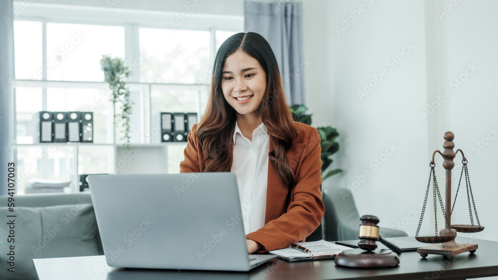 Online consulting with laptop in office of asian thai japanese chinese female exclusive lawyer legal advisor, legislation, saleswoman, legal contract documents Online consulting with laptop in office of asian thai japanese chinese female exclusive lawyer legal advisor, legislation, saleswoman, legal contract documents