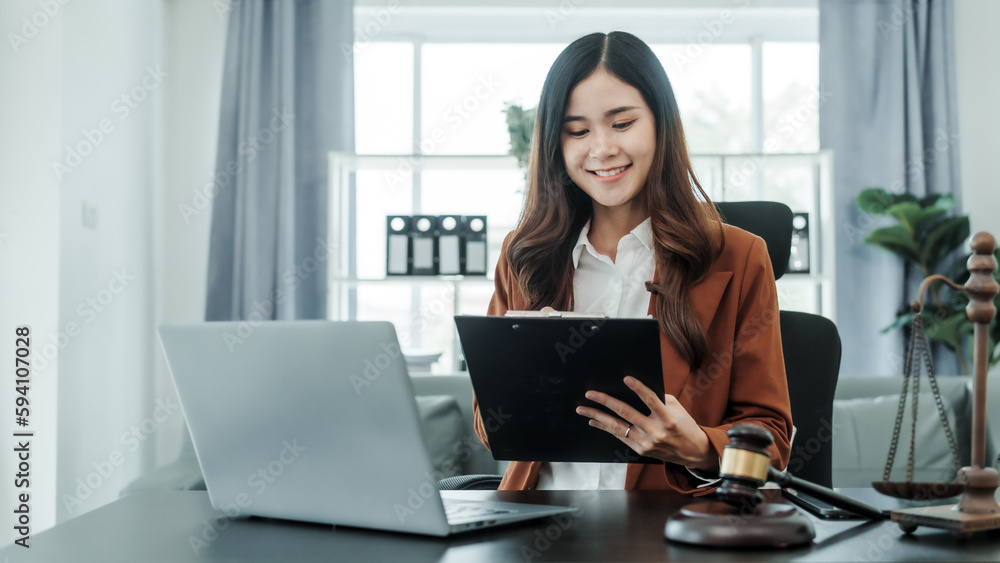 Online consulting with laptop in office of asian thai japanese chinese female exclusive lawyer legal advisor, legislation, saleswoman, legal contract documents Online consulting with laptop in office of asian thai japanese chinese female exclusive lawyer legal advisor, legislation, saleswoman, legal contract documents