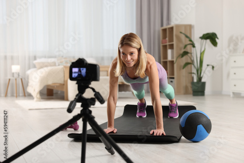 Fitness trainer recording online classes at home