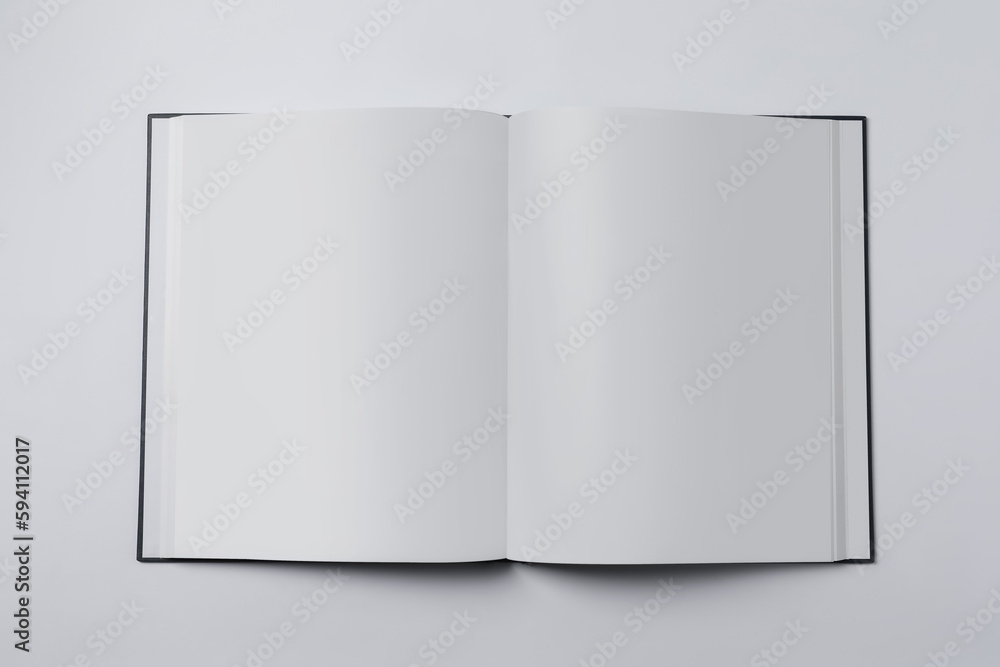 Open book on white background, top view Open book on white background, top view