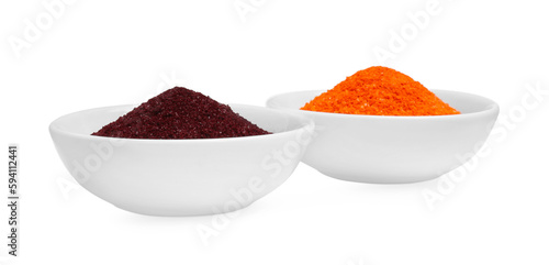 Bowls with food coloring on white background