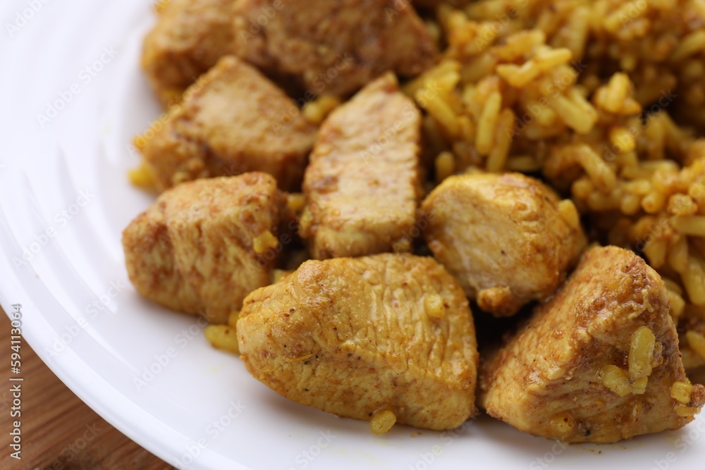 Delicious chicken with rice on plate, closeup