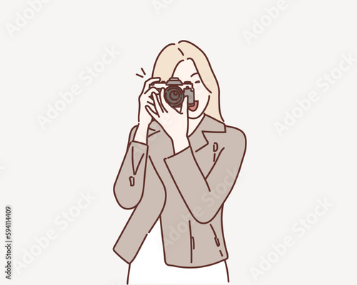 Photographer woman girl is holding dslr camera taking photographs. Hand drawn style vector design illustrations.