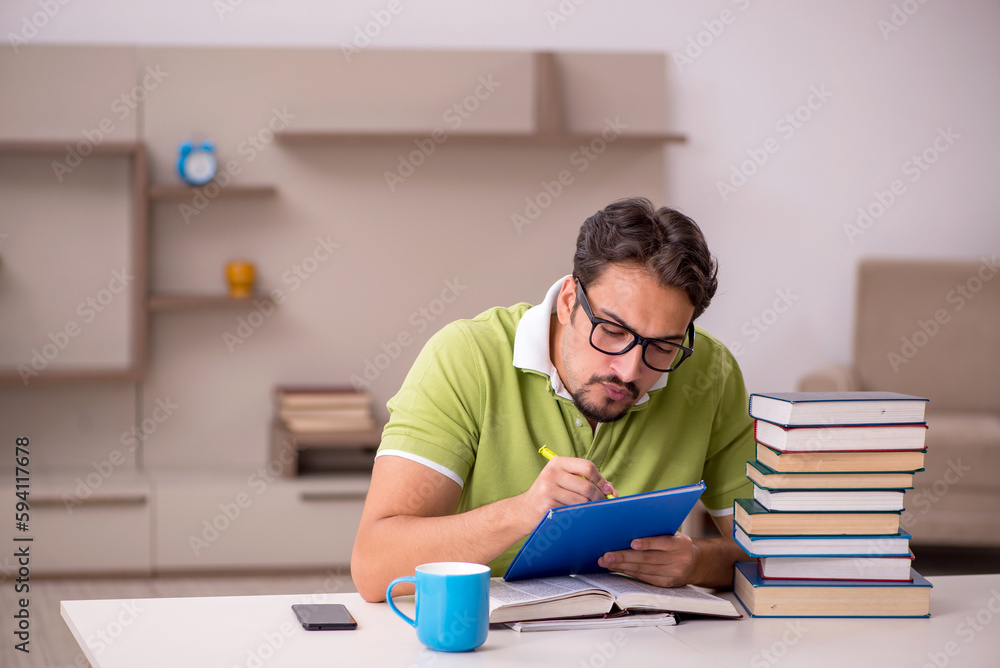 Young male student studying at home Young male student studying at home