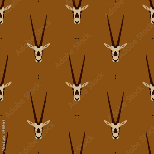 Seamless animal pattern with horned heads of Oryx antelope. Scimitar oryx. Oryx dammah. On orange brown background.