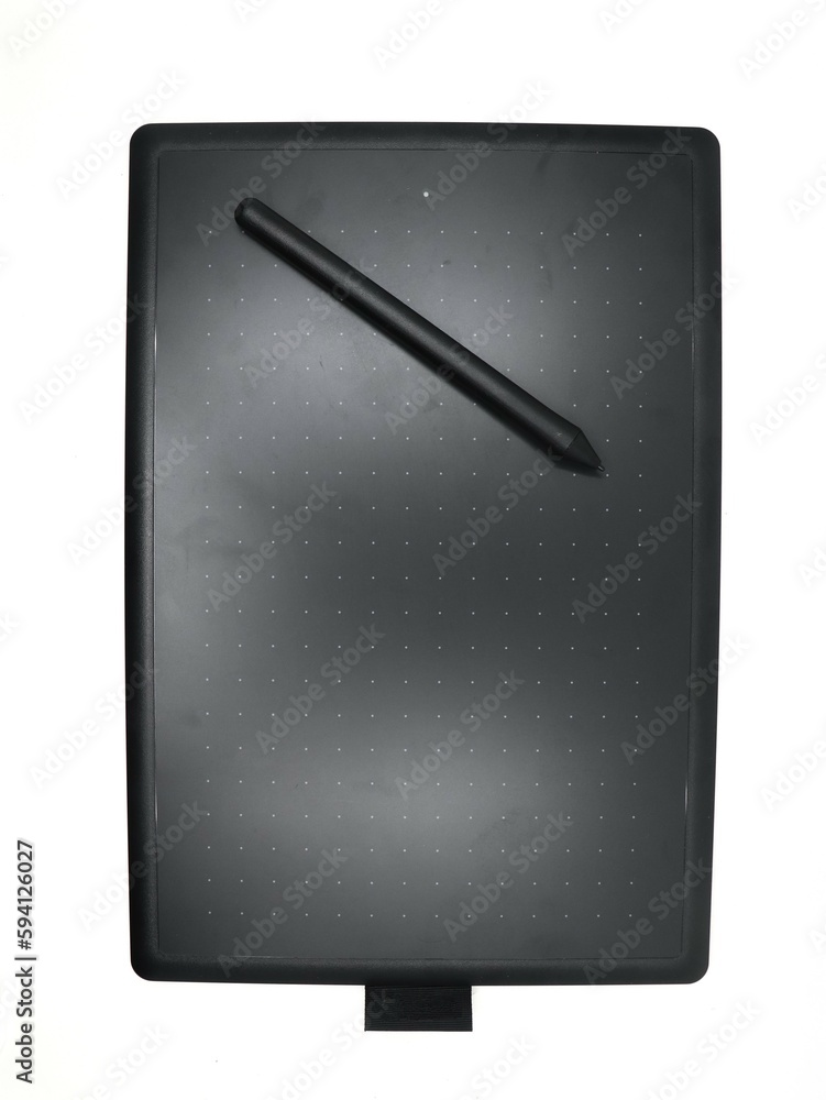 a black digital sketching tablet for artists and designers with a pen tool isolated in a white background a black digital sketching tablet for artists and designers with a pen tool isolated in a white background