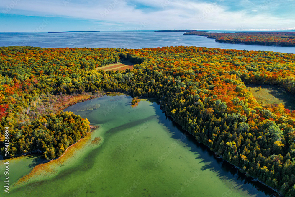 Wisconsin lake in the fall on a warm sunny autumn day, drone footage