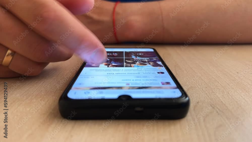 A man is browsing the social media feed on his phone. Dependence of a person on the phone. Time lapse. A man is browsing the social media feed on his phone. Dependence of a person on the phone. Time lapse.