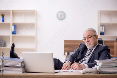 Wallpaper Mural Old male boss employee working in the office Torontodigital.ca