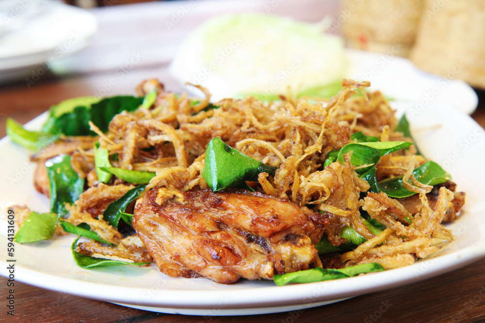 Stir-Fried Chicken with Lemongrass, on a white plate, close up, selective focus Stir-Fried Chicken with Lemongrass, on a white plate, close up, selective focus