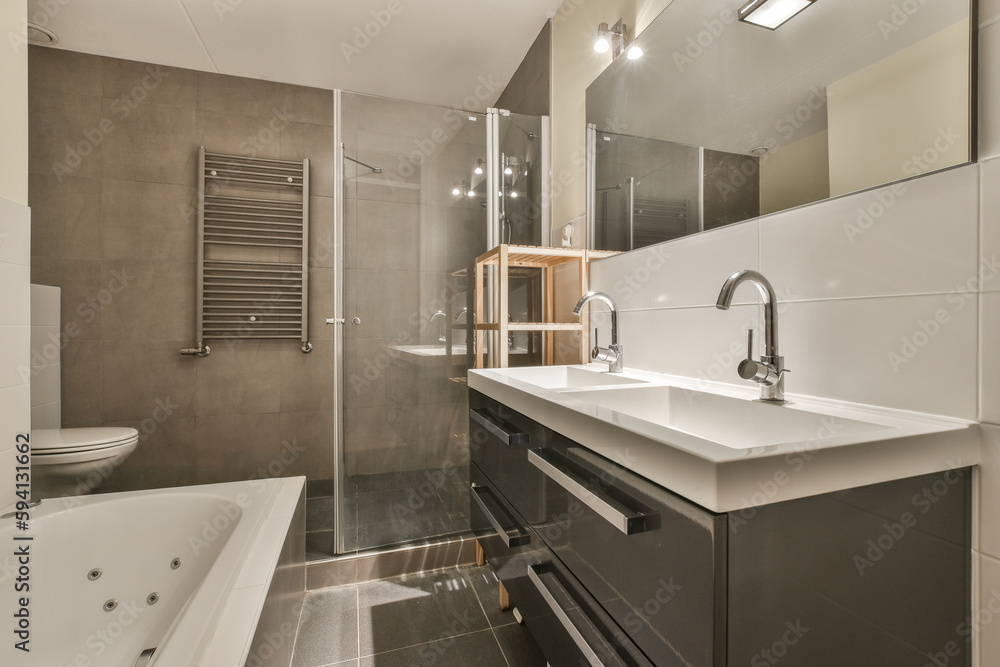 a bathroom with a tub, sink and bathtub in the middle of the room on the right is a large mirror a bathroom with a tub, sink and bathtub in the middle of the room on the right is a large mirror