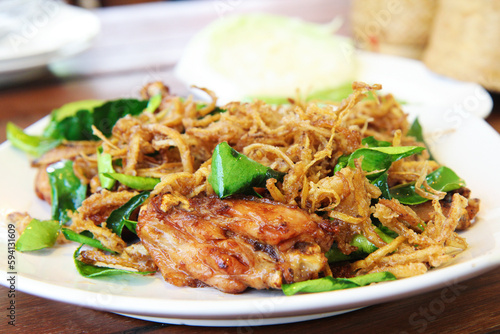 Stir-Fried Chicken with Lemongrass, on a white plate, close up, selective focus