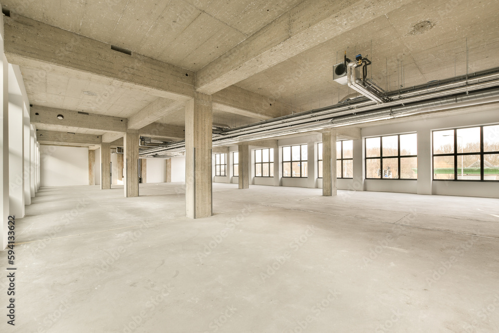 an empty building that is being used as a commercial space for rent or rental property, with no one person in the room an empty building that is being used as a commercial space for rent or rental property, with no one person in the room