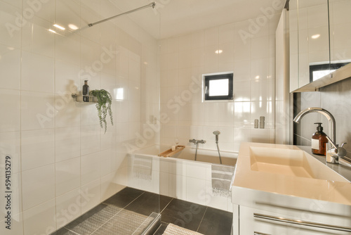 a bathroom with a sink  mirror and shower head mounted on the wall in it s corner to the right