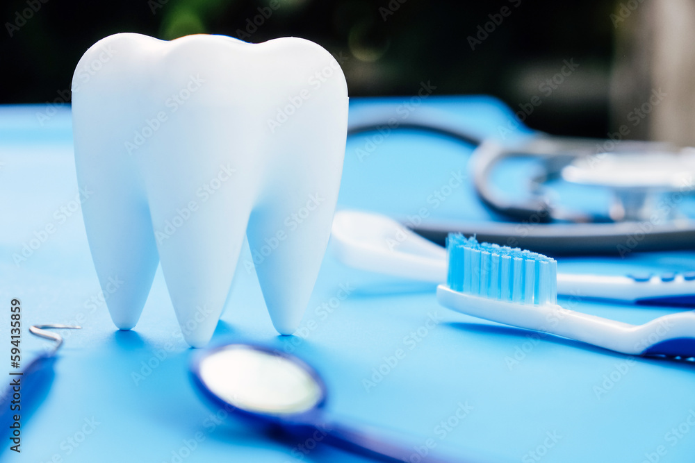 Dental model and dental equipment on blue background, concept image of dental background. Dental model and dental equipment on blue background, concept image of dental background.