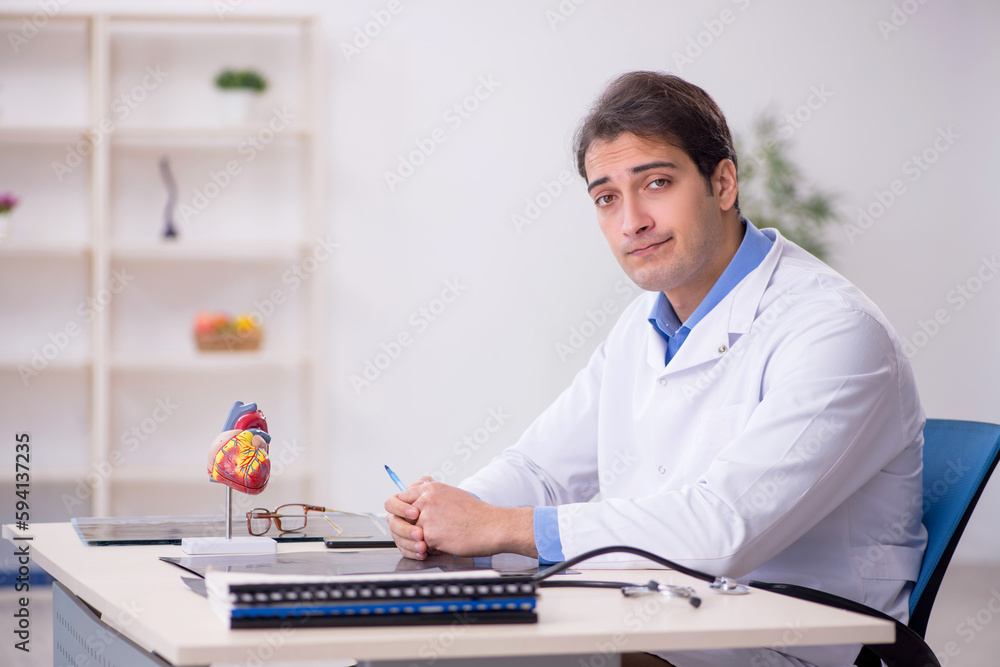 Young male doctor being tired after night shift Young male doctor being tired after night shift