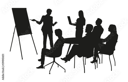 Team leader or manager giving a presentation standing and pointing on flip chart silhuette.