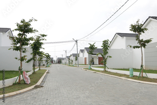 new housing with white walls with cobbled streets, modern residential houses