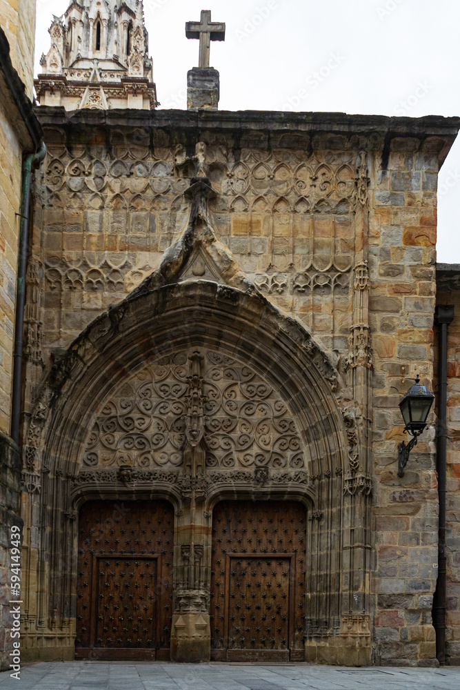 Facade and gates, Old wooden doors Cathedral of Santiago, Bilbao, Spain.