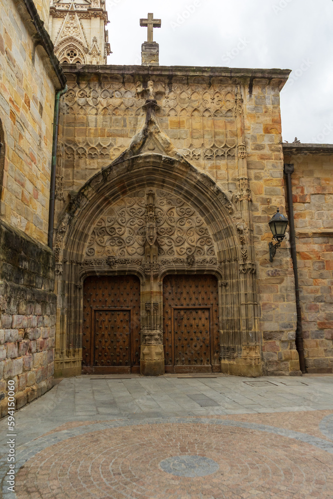 Facade and gates, Old wooden doors Cathedral of Santiago, Bilbao, Spain. Catedral de Santiago de Bilbao.