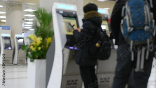 Auto machine check in plane tickets of Jeju International Airport for Korean people and foreign traveler passengers journey travel visit and checkin on February 18, 2023 in Jeju do island, South Korea photo
