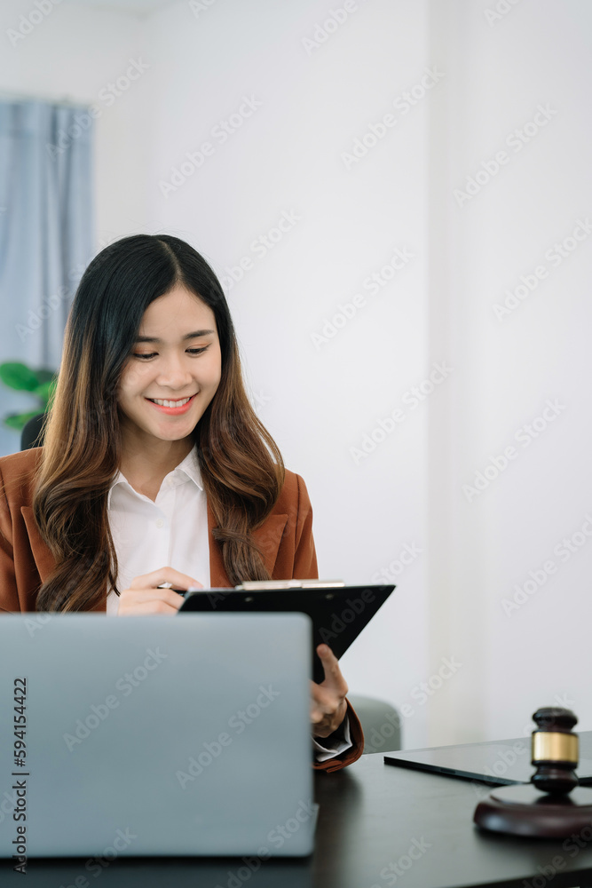 Lawyer office. gavel of Justice with scales and lawyer working on a laptop. Legal law, advice and justice concept. Lawyer office. gavel of Justice with scales and lawyer working on a laptop. Legal law, advice and justice concept.