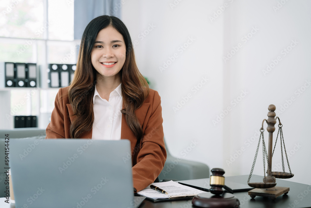 Lawyer office. gavel of Justice with scales and lawyer working on a laptop. Legal law, advice and justice concept. Lawyer office. gavel of Justice with scales and lawyer working on a laptop. Legal law, advice and justice concept.