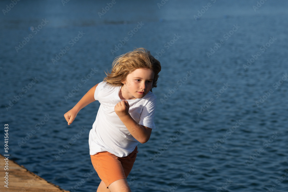 Healthy sport activity and running for children. Little boy at race. Young athlete in training. Runner exercising. Jogging for kid. Happy childhood. Healthy sport activity and running for children. Little boy at race. Young athlete in training. Runner exercising. Jogging for kid. Happy childhood.
