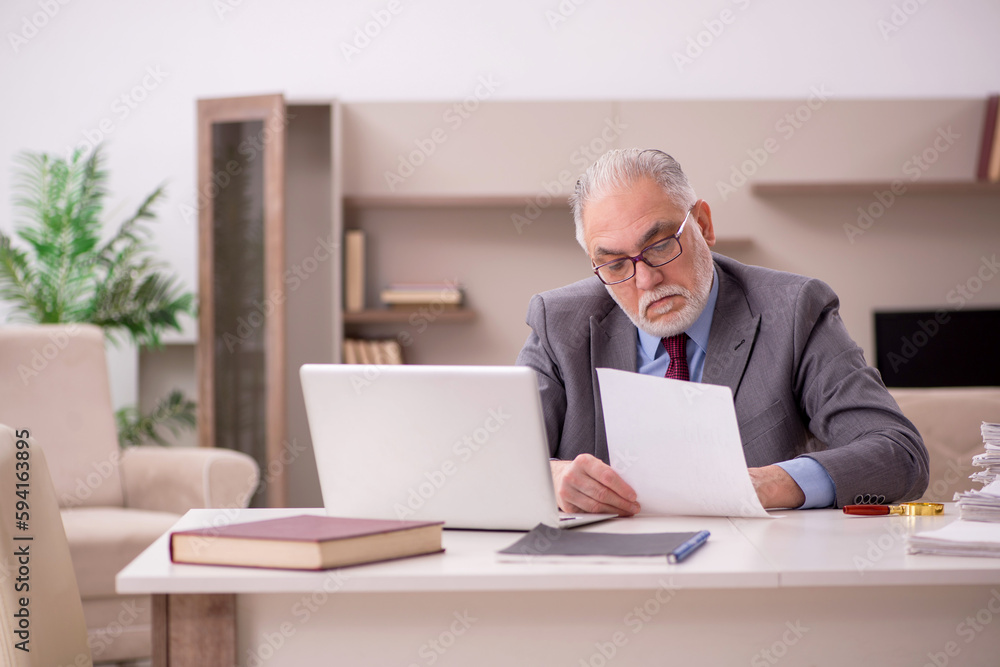 Old male employee working from home during pandemic Old male employee working from home during pandemic