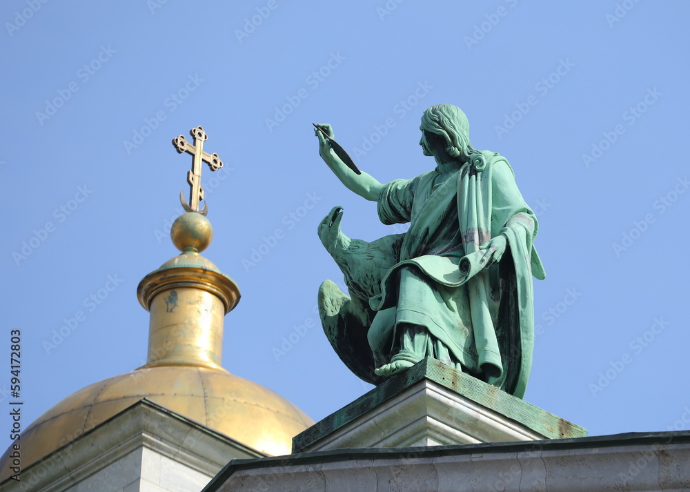Statue of John with an eagle on the roof of St. Isaac's Cathedral, St. Petersburg, Russia, April 2023