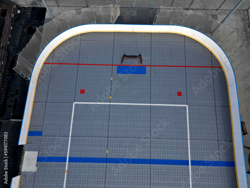 field hockey or ice hockey field. plastic grids of the dportovist surface under which there are hoses with cooling liquid. drone view of a modern ice rink. barriers and puck nets, aerial photo