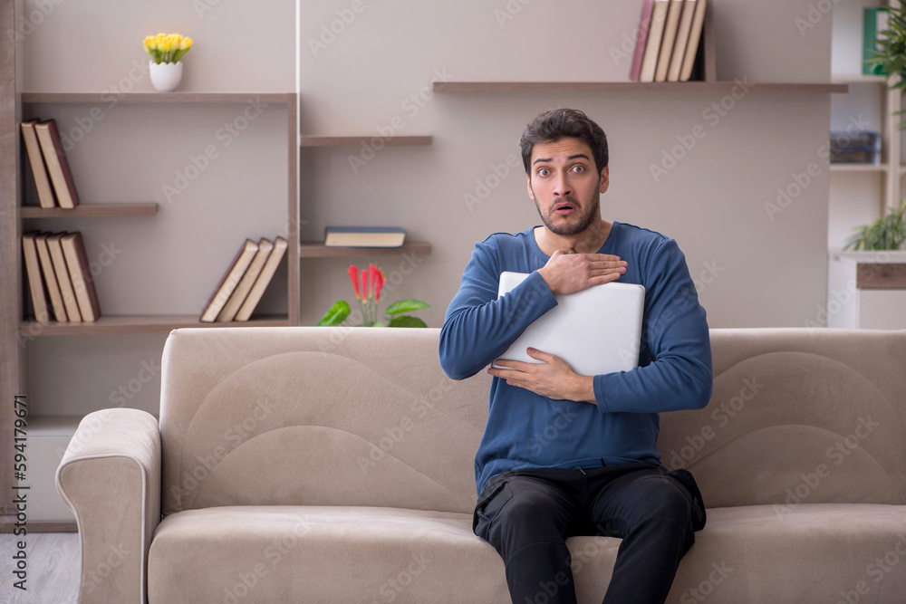 Young male freelancer working from home during pandemic Young male freelancer working from home during pandemic