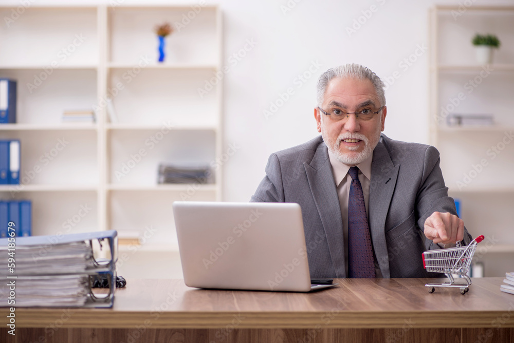 Old male employee in e-commerce concept Old male employee in e-commerce concept