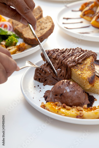 Chocolate french toast and banana slice served with chocolate gelato.