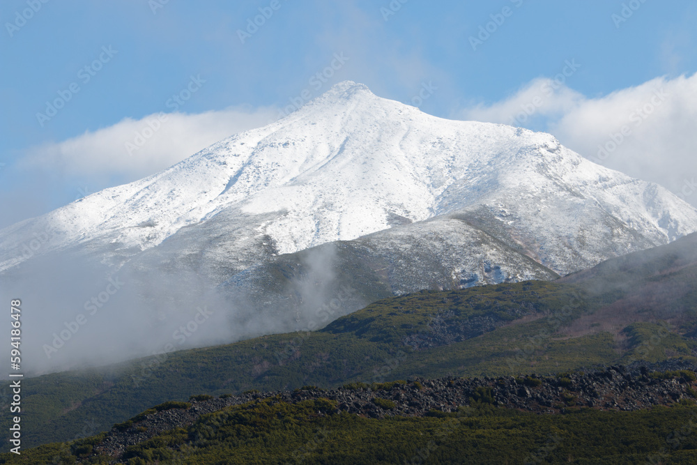 Snow-capped volcano mountain in autumn