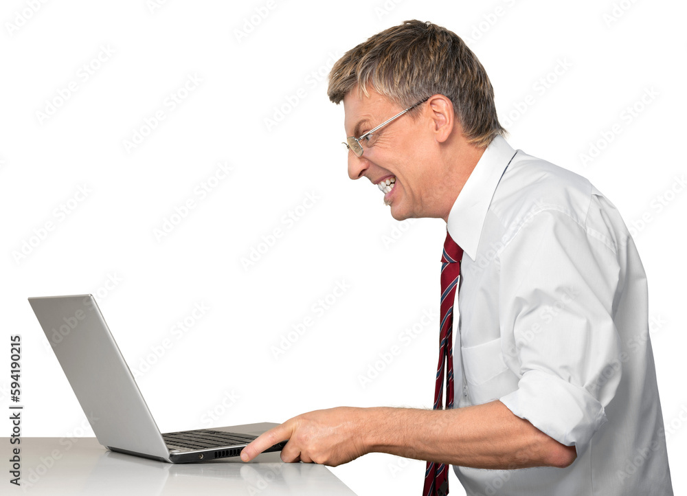 Frustrated businessman using a laptop Frustrated businessman using a laptop