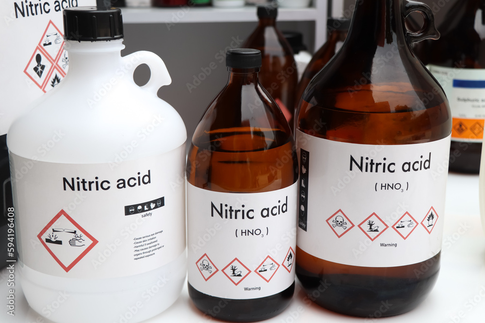 Nitric acid, Hazardous chemicals and symbols on containers Stock Photo