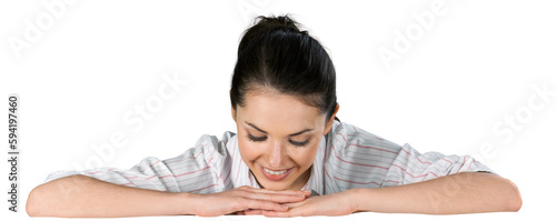 Woman with folded arms looking down on a blank surface
