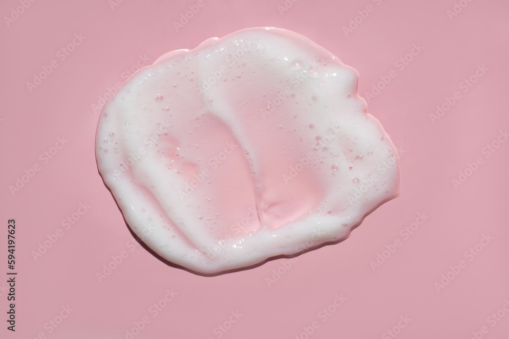 White lather foam moisturizer cleanser on pink