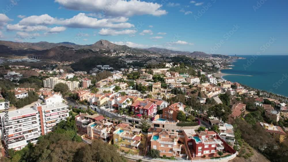 Aerial dolly towards homes on top of mountain peak in Malaga Spain Aerial dolly towards homes on top of mountain peak in Malaga Spain