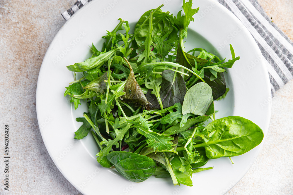 green salad leaves fresh mix healthy snack food on the table copy space food background rustic top view green salad leaves fresh mix healthy snack food on the table copy space food background rustic top view