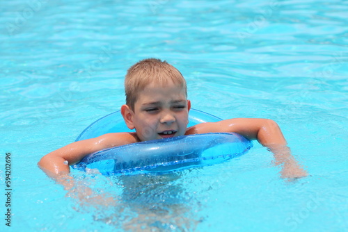 Happy baby in the pool.