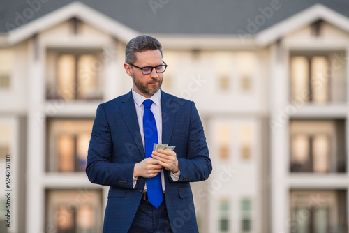 Broker or real estate agent. Business man with money banknotes. Male entrepreneur with dollar bills. Lucky boss, insurance agent, manager. Freelancer with cash.