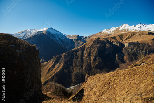 beautiful mountain landscape. ragged mountain peaks, sharp peaks in the snow brown mountains in the snow