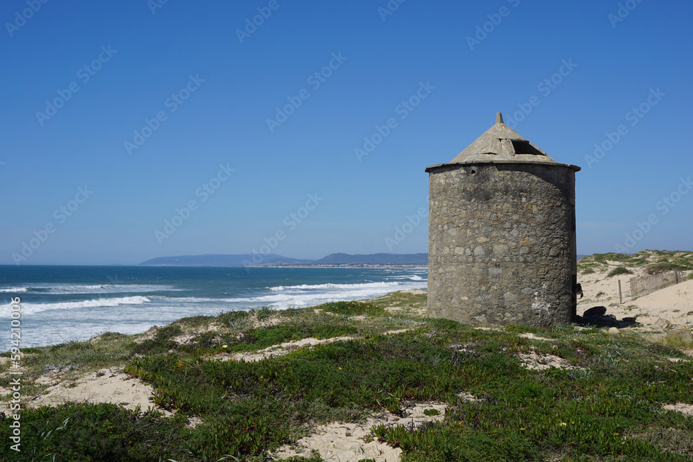 Landscape with traditional windmill on the atlantic coast of Portugal

